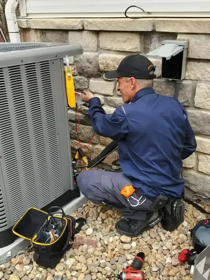 Technician running AC diagnostics