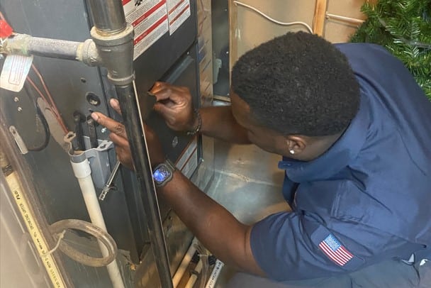 Tech Working On Furnace in Denver