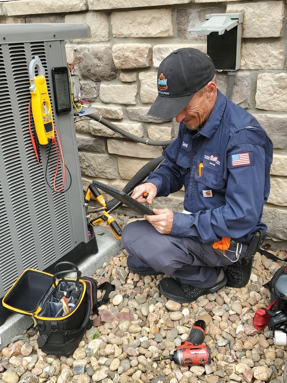 technician performing AC repair in denver