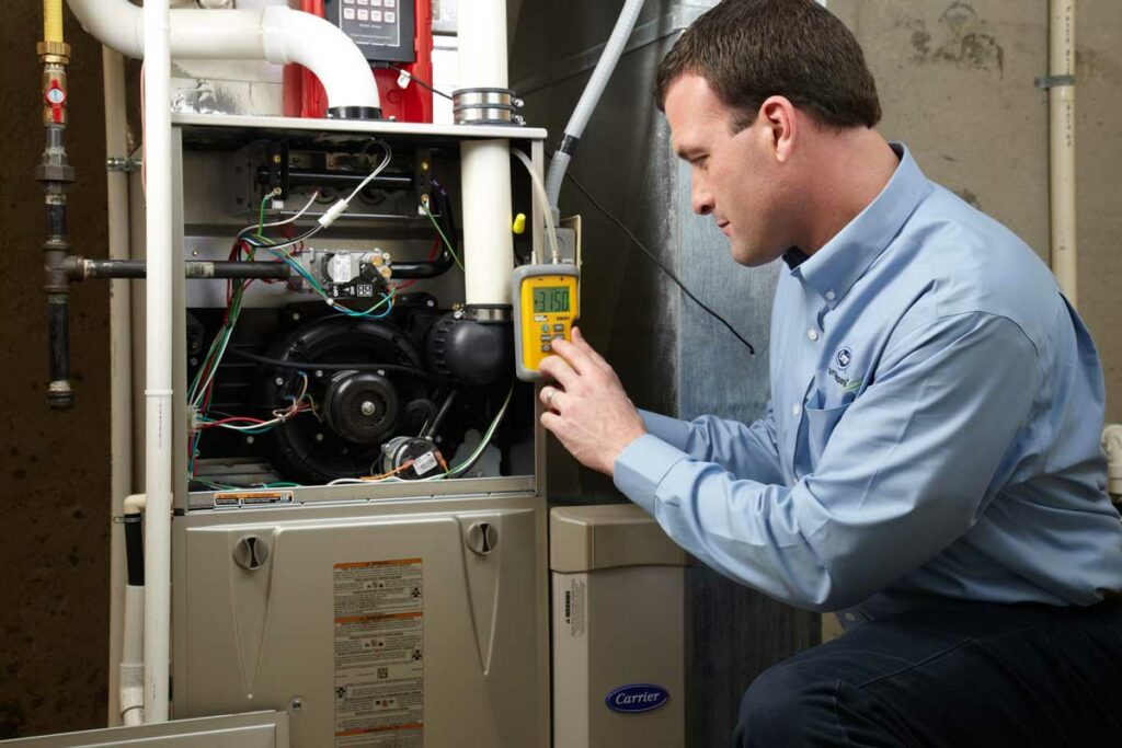 heating technician testing furnace in denver