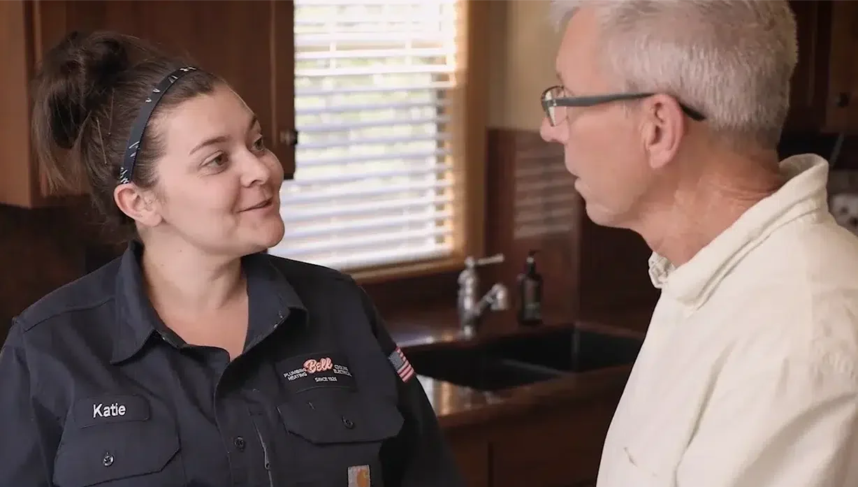 Customer talking to happy technician